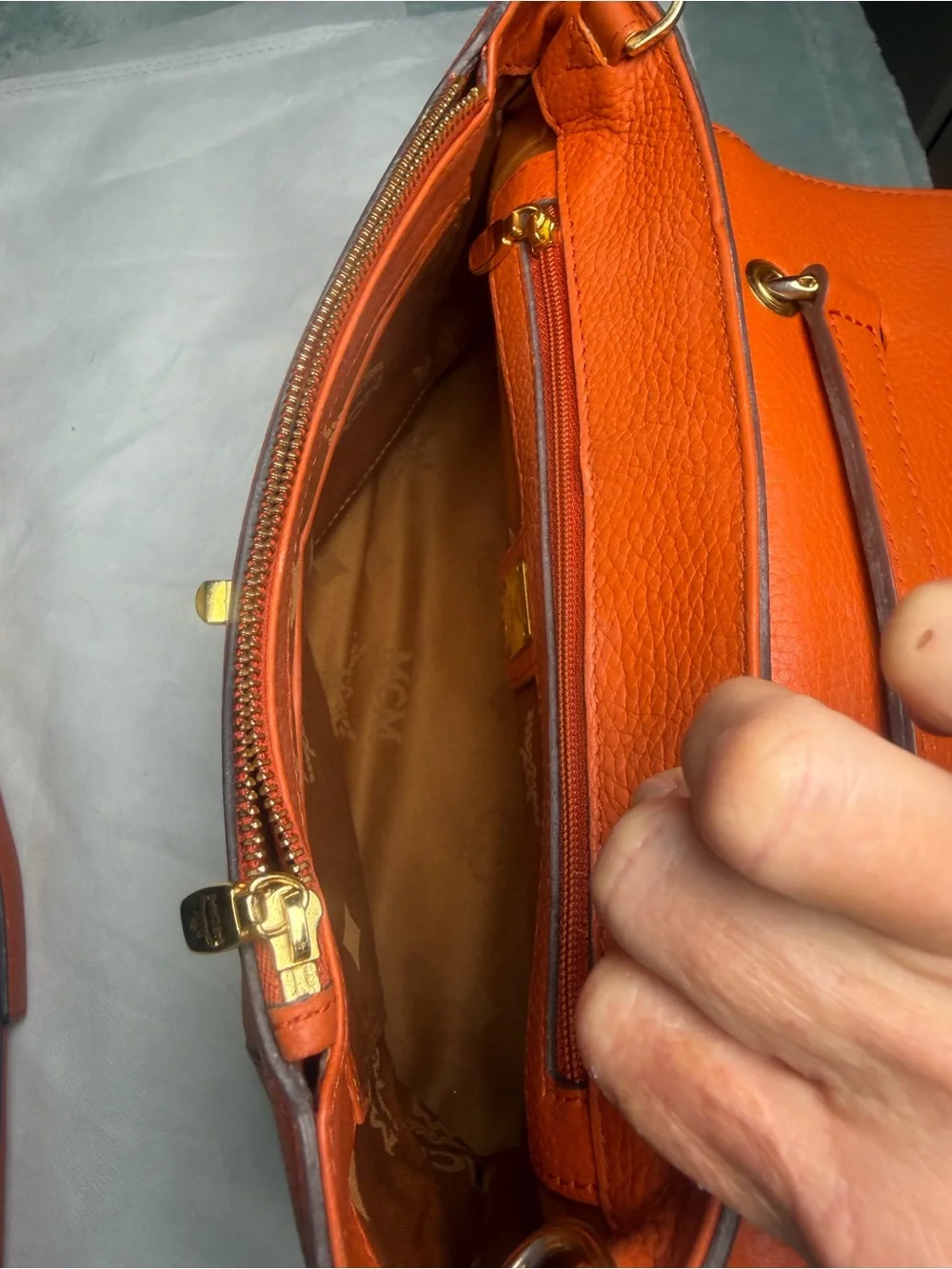 Structured Orange Leather Satchel with Top Handle and Crossbody Strap